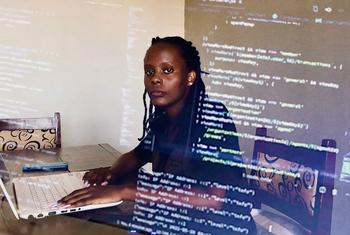 A coder in Kigali, Rwanda designs apps to encourage savings and financial independence.