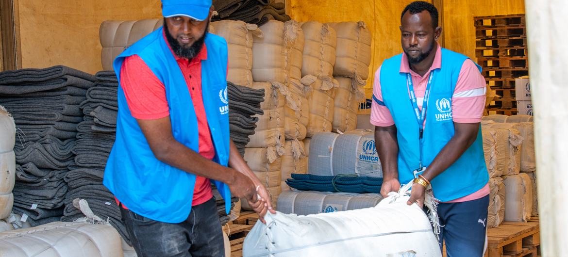 UNHCR staff prepare relief items to be distributed to refugee families in Dadaab camp.