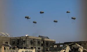 An airdrop of humanitarian aid targets northern Gaza in late July.