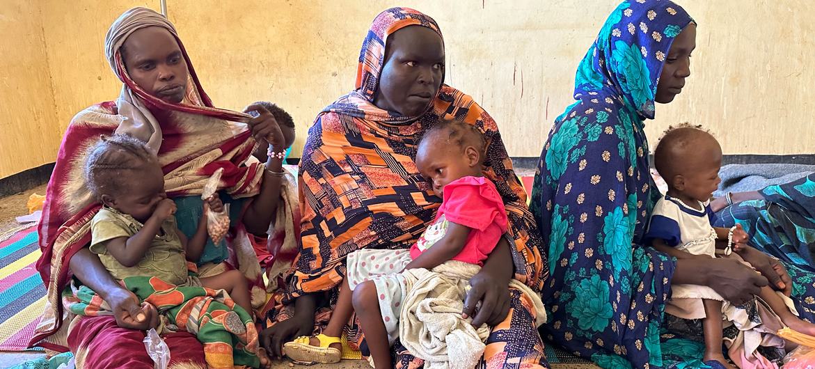 Mothers and their children attend a nutrition centre in Tawila in North Darfur State, Sudan.