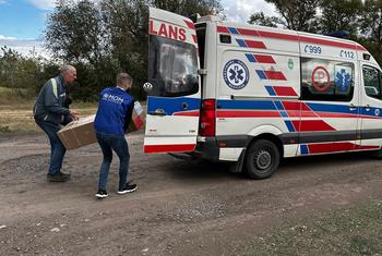 UN personnel load supplies onto an ambulance in Hroza, eastern Ukraine.