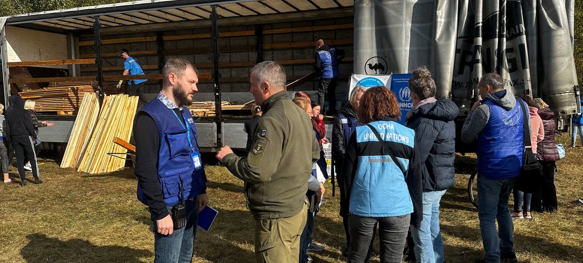 UN humanitarian workers visit the village of Hroza in the east of Ukraine, following an airstrike in October. (file)