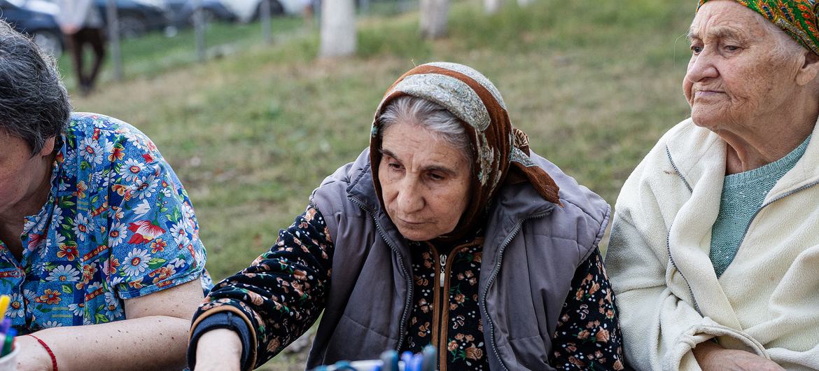 Ana (center) sits with other older women who have sought support in the center of Chișinău. Ana (center) sits with other older women who have sought support in the center of Chișinău.