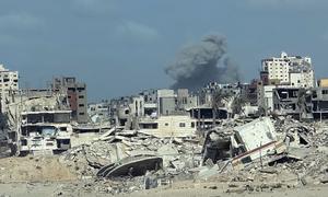 Smoke rises from a bombed building in Gaza City.