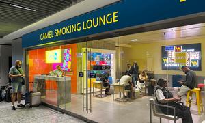 Passengers smoke in a designated lounge at Frankfurt airport in Germany.