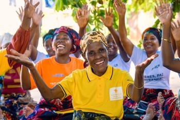Maria de Lurdes leads a group of women in a community gathering in Cabo Delgado, Mozambique, promoting peace and empowerment.