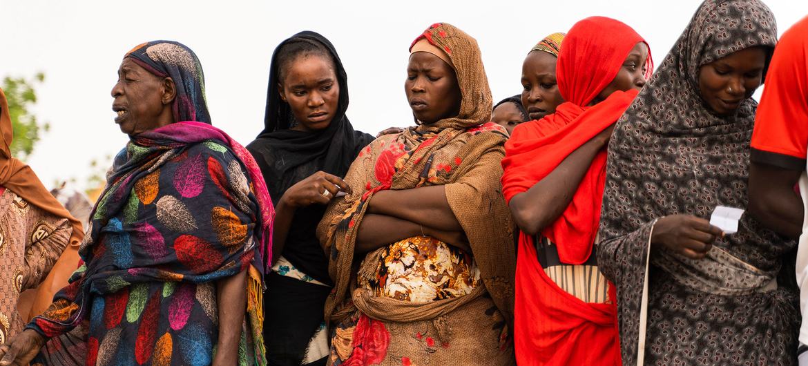 Women waiting for aid distribution in Wad Madani, Sudan.