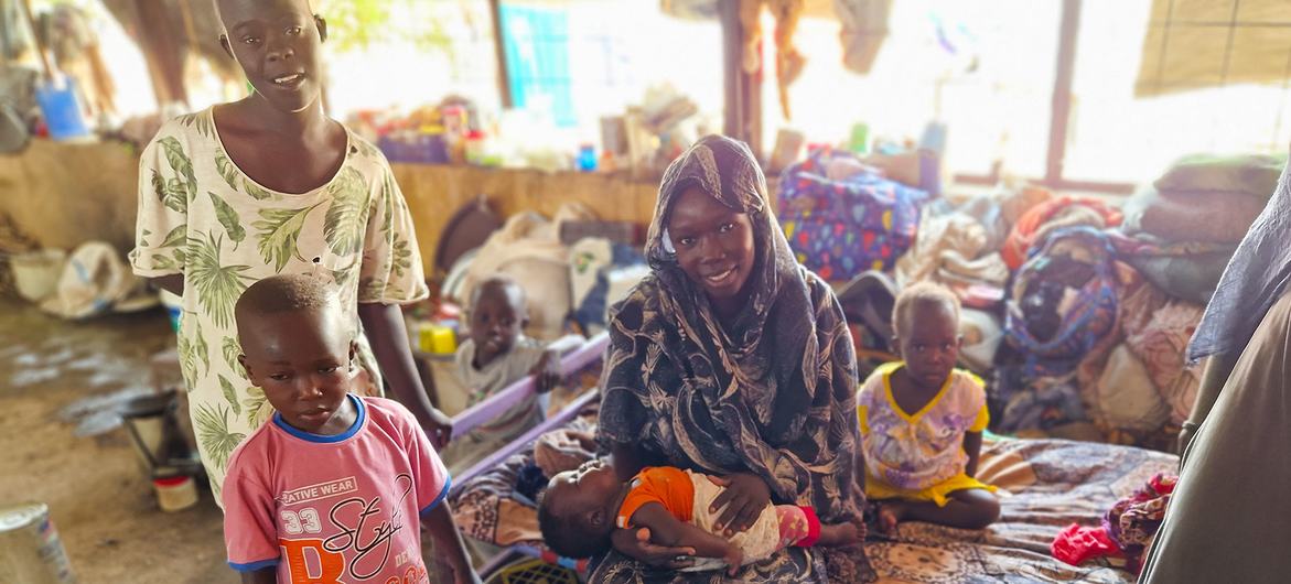 A family displaced by conflict settle at an IDP gathering site in Aj Jazirah, Sudan.