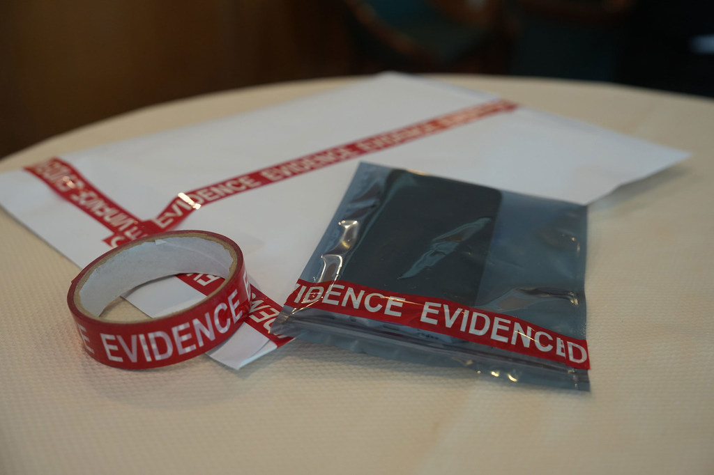 A mobile phone, evidence in an anti-cybercrime operation in Southeast Asia, is set aside for analysis. A mobile phone, evidence in an anti-cybercrime operation in Southeast Asia, is set aside for analysis.
