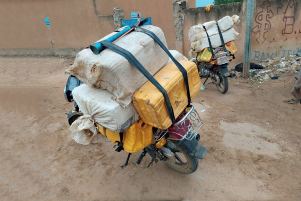 Motorcycles carrying smuggled fuel in Dosso, Niger, near the Nigerian border.