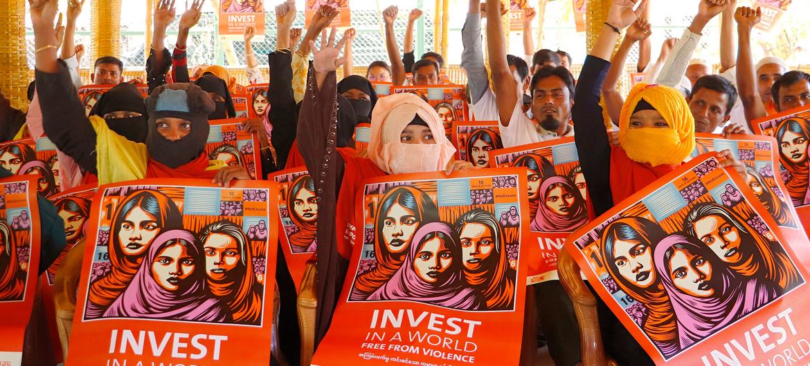 Women and men in Cox's Bazar in Bangladesh participate in an Orange the World event to end violence against women.