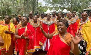 Kenyans celebrate following the signing of commitments by councils of elders to end female genital mutilation in the Samburu and Mount Elgon regions.