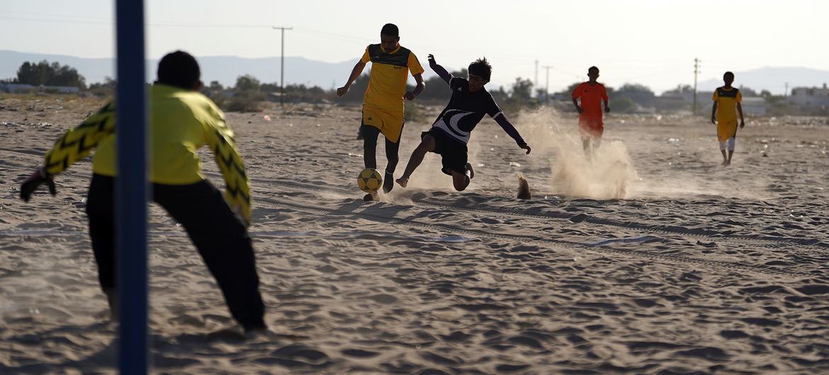 Player in football tournament for displaced people in Ma'rib, Yemen Player in football tournament for displaced people in Ma'rib, Yemen