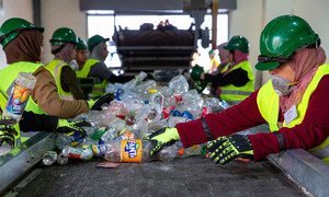 Women sort plastic at a recycling plant in Jordan.
