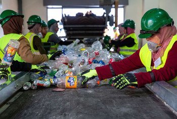 Women sort plastic at a recycling plant in Jordan.