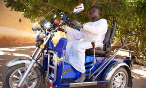 Sheij Aldine, a member of the Sudanese Association for Disabled People, rides a special motorbike provided by the organization in North Darfur, Sudan. (file)