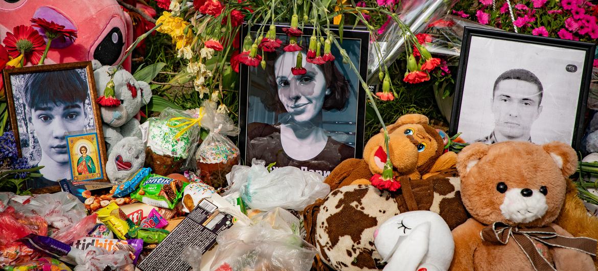Toys, flowers, and candles are laid to honour people killed during an airstrike on Kyiv. (file)