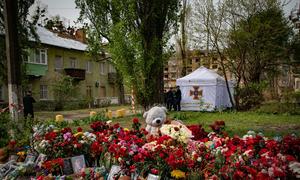 Toys and flowers are laid in memory of those killed in an attack in Kyiv, Ukraine.
