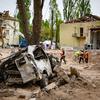 Workers clear debris following attacks in Kyiv, Ukraine, in April 2025.