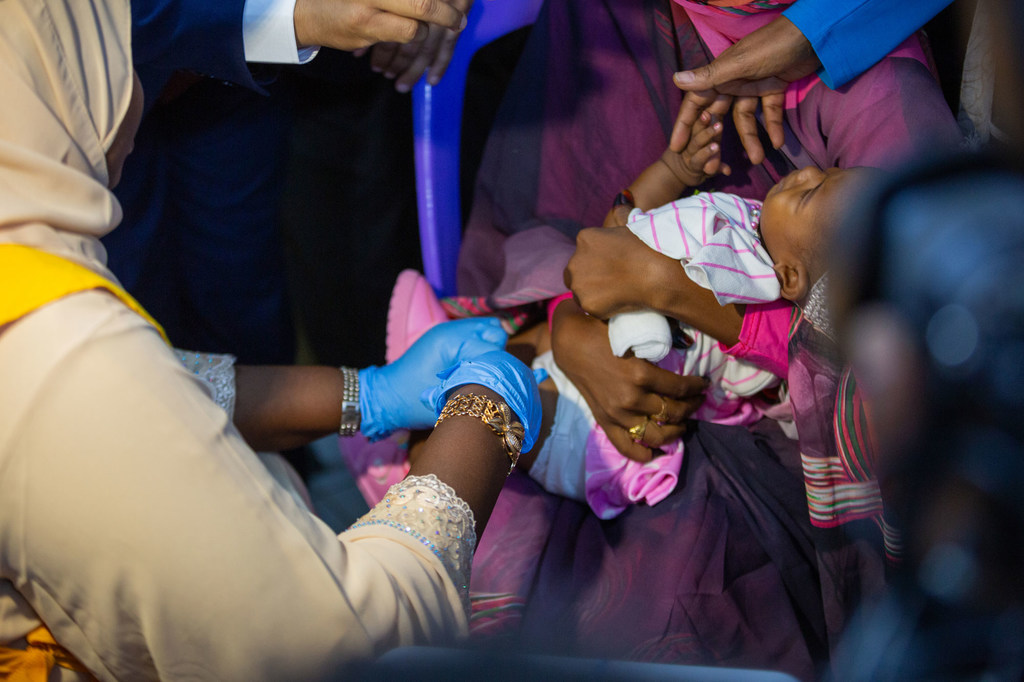 A baby receives a malaria vaccine in Sudan.