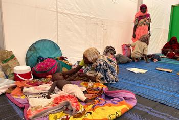 A mother who fled across the Sudanese border to Chad cares for her malnourished child. 