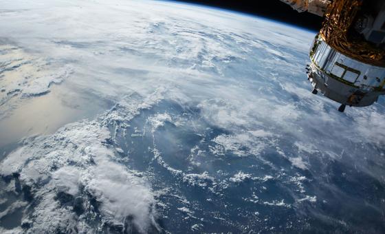 A view of the Earth and a satellite as seen from outer space.