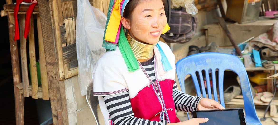 Learning Coin student Arisa, 17, works with a tablet provided through the initiative.