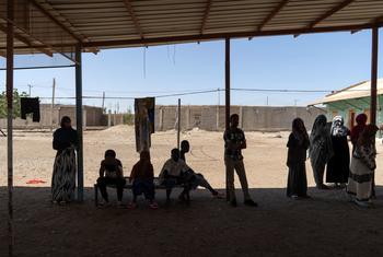 People displaced by the conflict in Sudan rest at a facility in eastern Sudan after fleeing Khartoum.