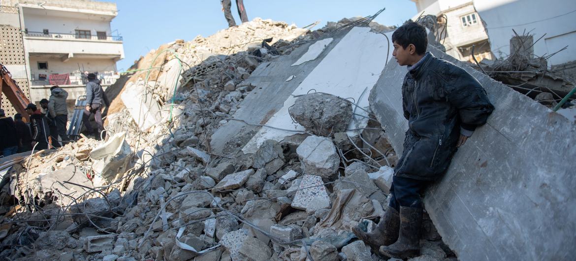 A boy in Jableh city in northwestern Syria watches excavation work following the February 2023 earthquake. (file)