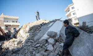 A boy in Jableh city in northwestern Syria watches excavation work following the February 2023 earthquake. (file)