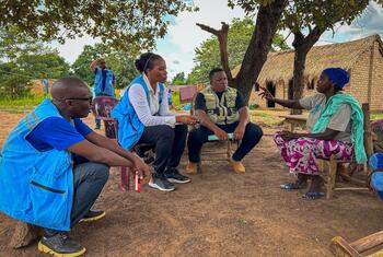 Edem Wosornu, Director of OCHA's Global Crisis Response Division, sits with displaced people in Zemio, Central African Republic, during a meeting with NGOs providing assistance.