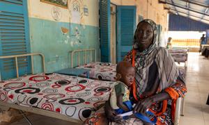 A woman holds her malnourished child in a  hospital in Blue Nile state in Sudan.