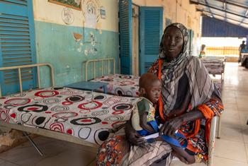 A woman holds her malnourished child in a hospital in Blue Nile state in Sudan.