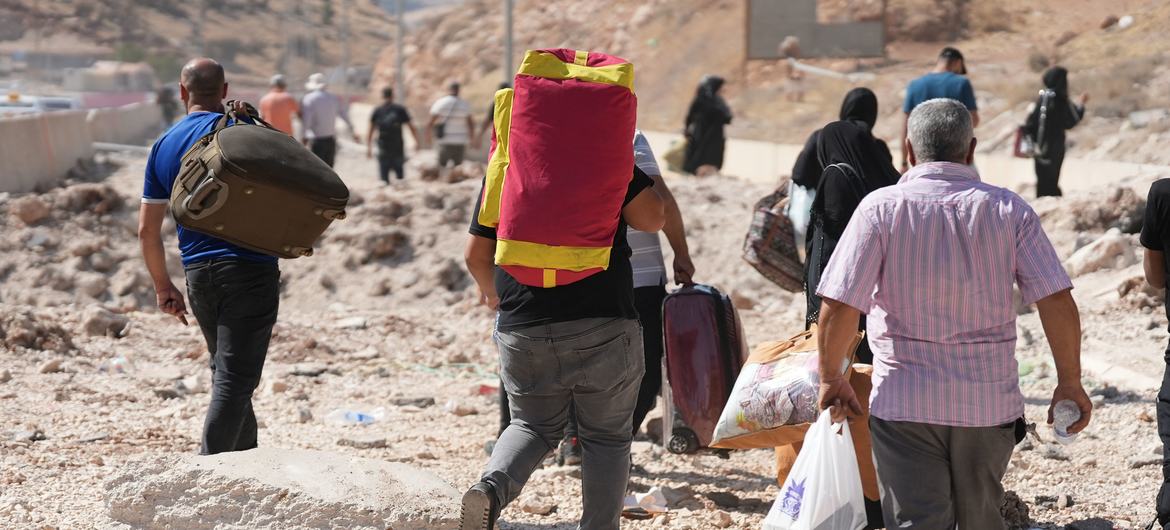 People flee into Syria from the bombardments in Lebanon. 