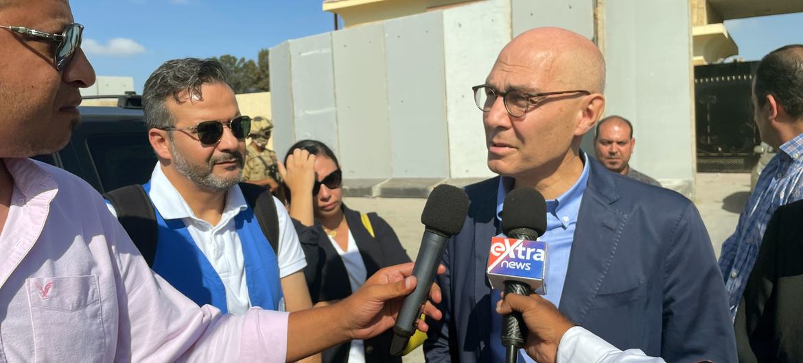 The UN human rights chief, Volker Türk, talks to the media at the Rafah crossing point into Gaza.