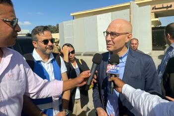 The UN human rights chief, Volker Türk, talks to the media at the Rafah crossing point into Gaza.