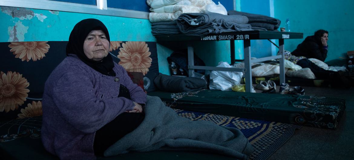 A woman, whose house was destroyed in the earthquake, rests in a shelter for displaced people in Jableh district. Syria