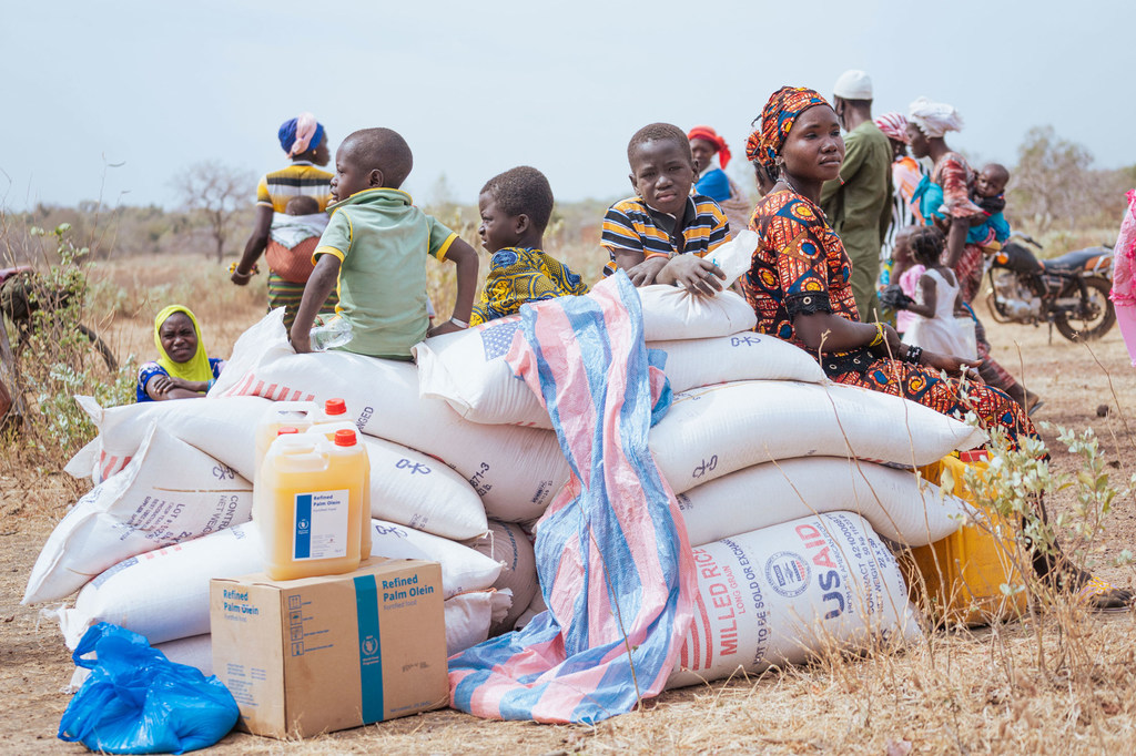 Vulnerable populations in Morolaba, Burkina Faso, receive emergency airlifted food assistance.