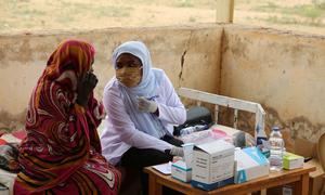 Midwives and other health professionals treat patients at the Khartoum Maternity Hospital in Sudan.