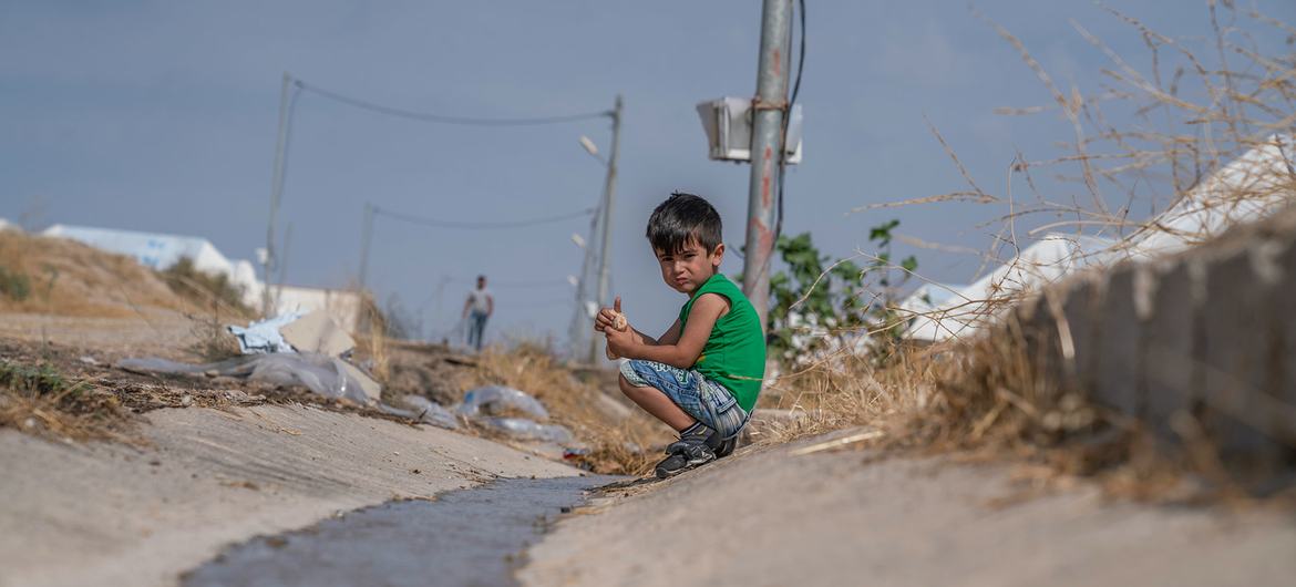 A six-year-old Syrian boy fled Iraq with his family due to conflict.