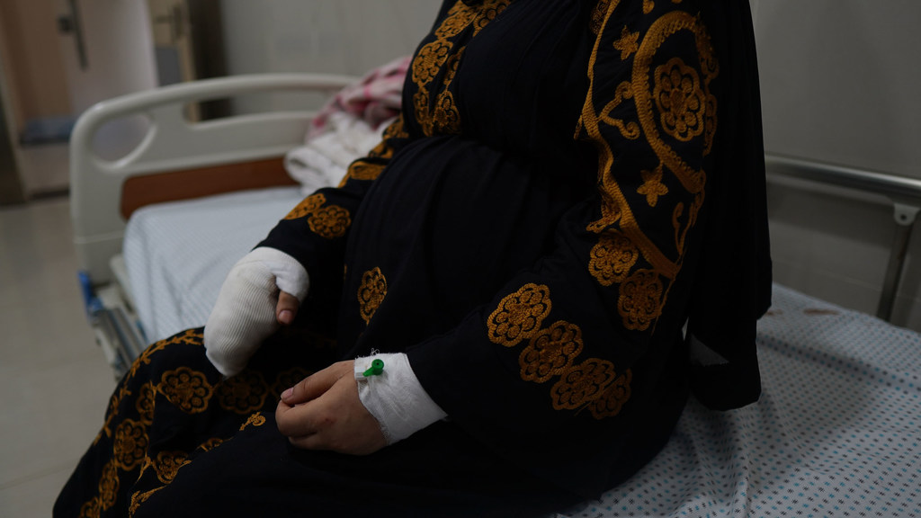 Walaa, 35, is nine months pregnant. Her home collapsed due to a nearby bombing while she was sitting against the very wall that fell. She sustained a fracture in her right hand and her skull during the incident.