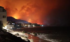 A wildfire burns in the Palisades suburb of Los Angeles, California.