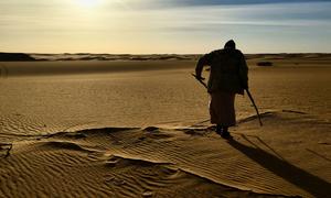 Migrants often cross the Libyan desert to reach smuggling routes across the Mediterranean Sea.