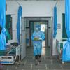 A nurse walks into a hospital ward in Janakpur in Dhanusha District in southern Nepal.