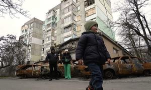 A young boy walks through the streets of Kherson in Ukraine.