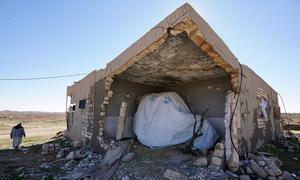 A shelter is set up in a house in Awenia in Libya, which has been largely destroyed by conflict.