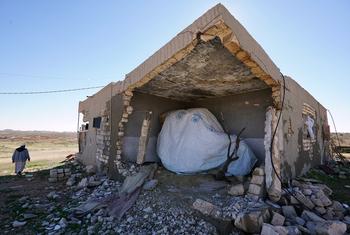 A shelter is set up in a house in Awenia in Libya, which has been largely destroyed by conflict.