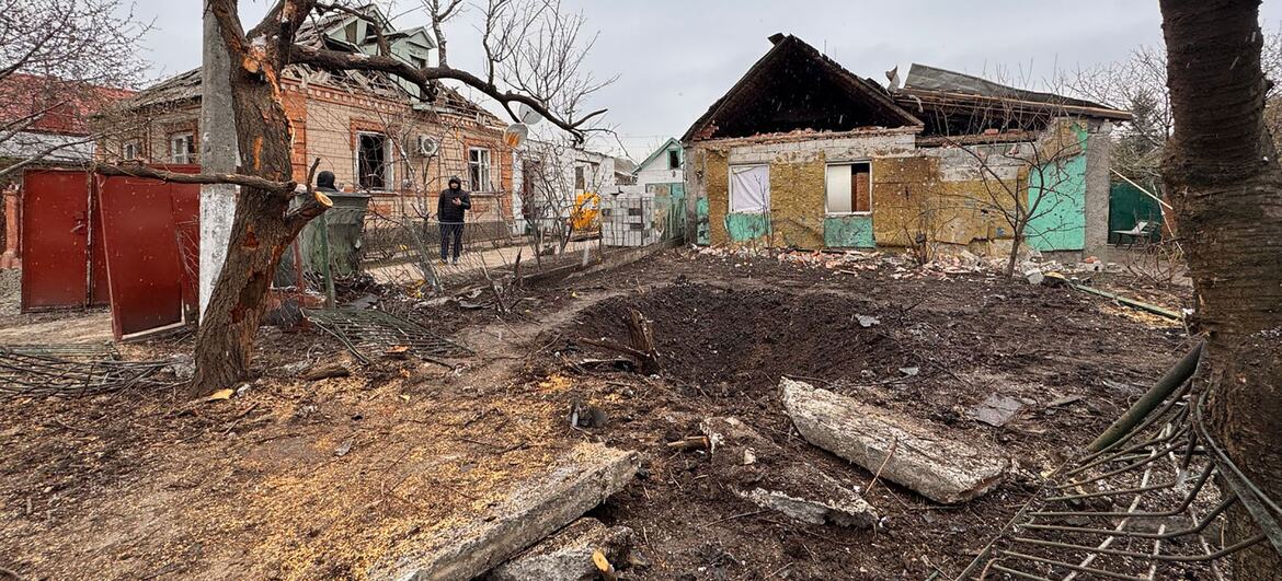 A rural area in Ukraine shows the signs of bomb damage.