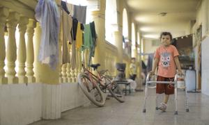 A young girl who lost her parents and siblings in a missile strike on their house is learning to walk again following the amputation of her leg.