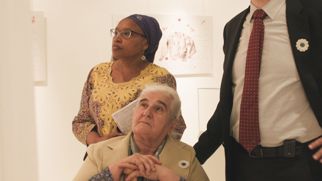 Munira Subašić, head of the Mothers of Srebrenica Association, (seated) and UN Special Adviser on the Prevention of Genocide Alice Nderitu at the Stories of Survival and Remembrance exhibit at UN Headquarters in New York.